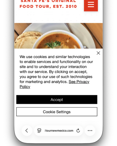 A food tour site on a phone, with a cookie notice covering half the screen.